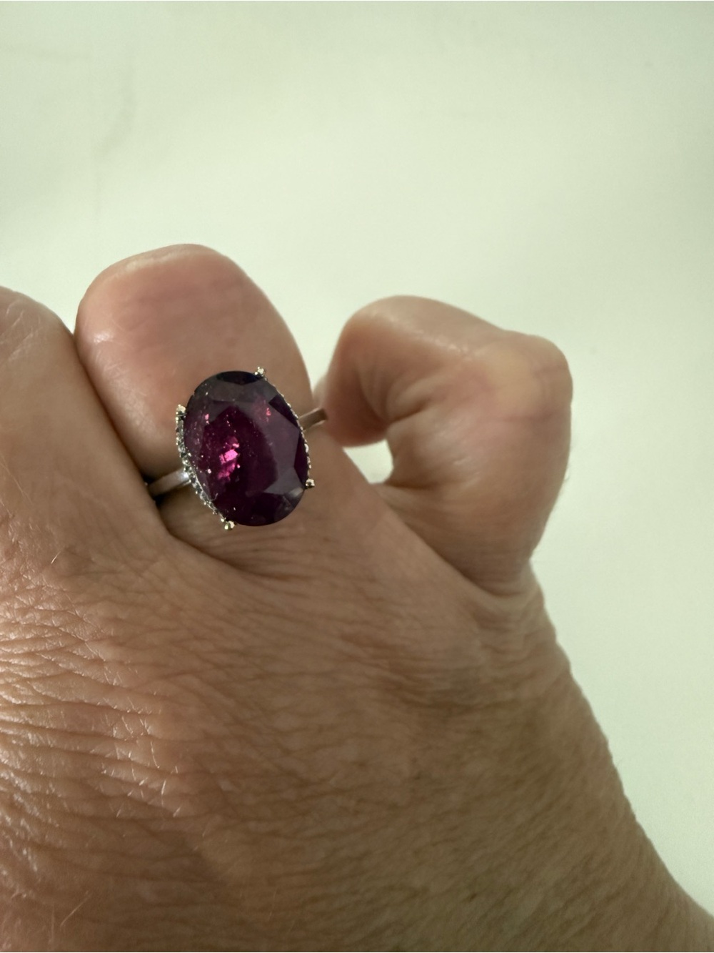 7ct oval Mahaleo Ruby ring set in solid 10k white gold with .11ct White Zircon